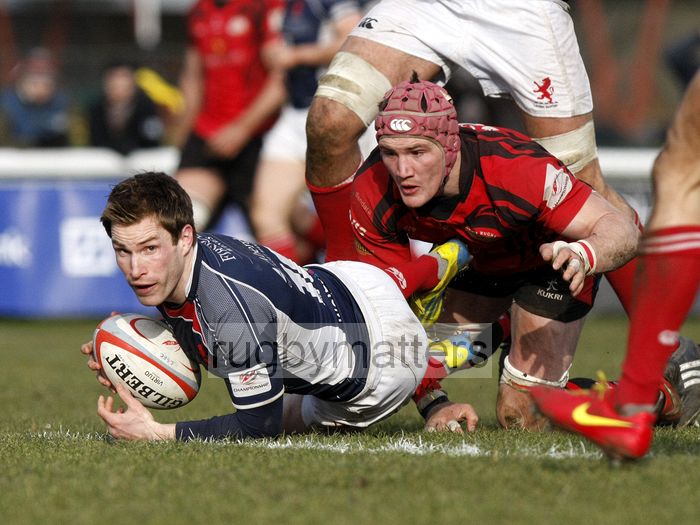 Phil Godman looks for support as he is tackled to the ground by Guy Thompson. London Scottish v Jersey at Richmond Athletic Ground, Kew Foot Road, Richmond on 2nd March 2013 KO 1400.