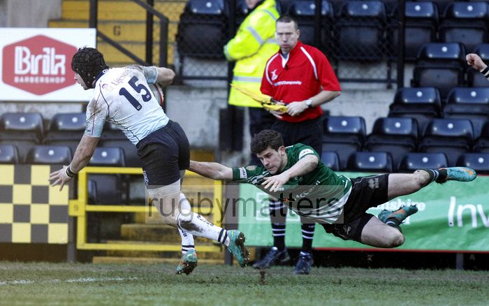 Ben Ransom evades the tackle of Tim Streather. Nottingham v Bedford at The County Ground, Nottingham on the 27th January 2013. RFU Championship - Stage 1.