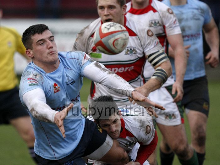 Peter Homan offloads the ball whilst Rhodri McAtee tackles him. Rotherham Titans v Plymouth Albion at Clifton Lane, Rotherham on 9th February 2013. KO 1430. RFU Championship - Stage 1.