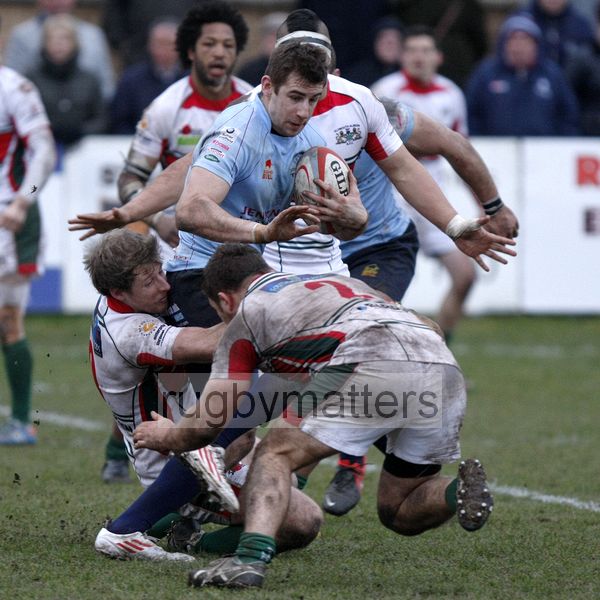 Michael Doneghan tackled by Ruairi Cushion and Jon Vickers. Rotherham Titans v Plymouth Albion at Clifton Lane, Rotherham on 9th February 2013. KO 1430. RFU Championship - Stage 1.