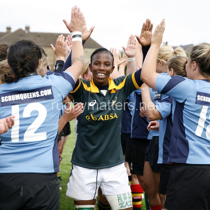 Lamla Momoti high fiving the Nomads in the tunnel. Nomads v South Africa, Twyford Avenue, London, England on 1st July 2014, ko 1400