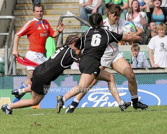 Gemma Sharples fights off the challenge on her way to the line for her try for England v New Zealand at IRB 7s Twickenham