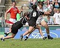 Gemma Sharples fights off the challenge on her way to the line for her try for England v New Zealand at IRB 7s Twickenham