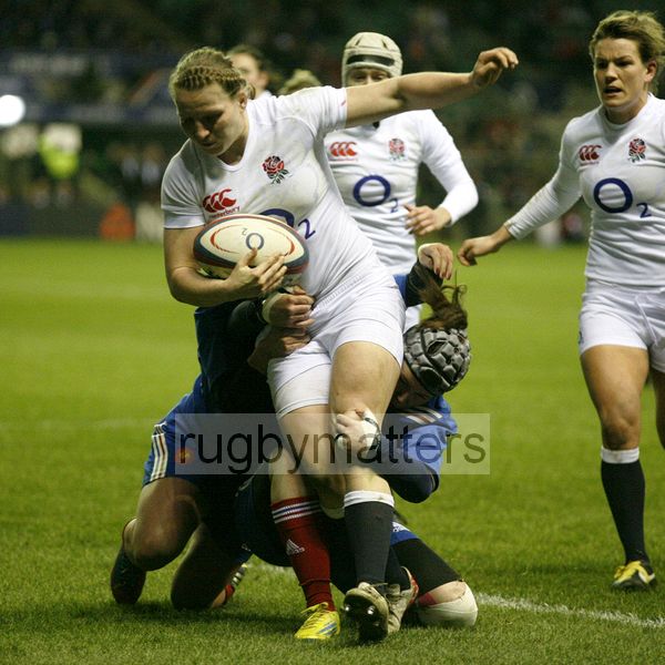 Hanah Gallagher stopped by a double tackle. England Women v France Women at Twickenham, London. 23rd February 2013, KO 1920.
