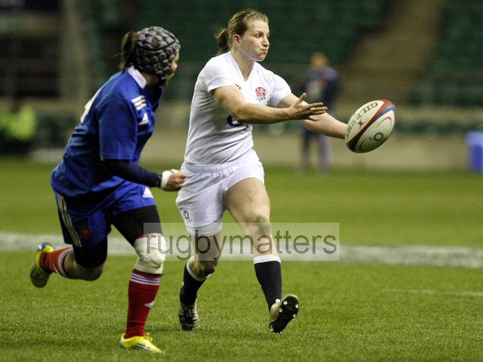 Hannah Gallagher passes the ball out wide. England Women v France Women at Twickenham, London. 23rd February 2013, KO 1920.