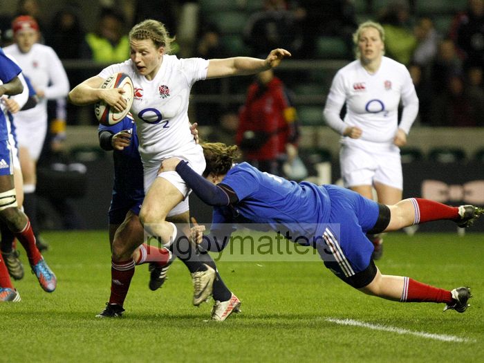Hannah Gallagher crashes through French tackles and goes on to score a try. England Women v France Women at Twickenham, London. 23rd February 2013, KO 1920.
