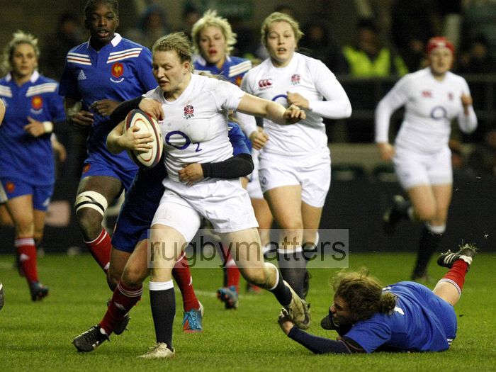 Hannah Gallagher crashes through French tackles and goes on to score a try. England Women v France Women at Twickenham, London. 23rd February 2013, KO 1920.
