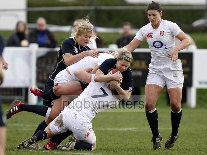 Lisa Ritchie tackled by Hannah Gallagher and Ceri Large. England Women v Scotland Women at Esher RFC on 2nd February 2013.