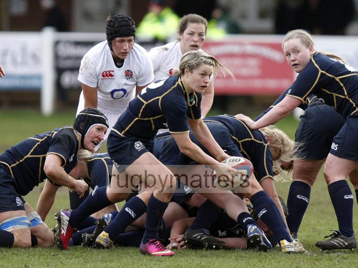 Lisa Ritchie looks to clear the ball from a ruck. England Women v Scotland Women at Esher RFC on 2nd February 2013.