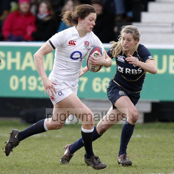 Jo McGilchrist makes a break with Annabel Sergeant closing in to tackle. England Women v Scotland Women at Esher RFC on 2nd February 2013.