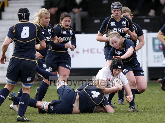 Emily Braund tackled by Lindsay Wheeler and Sarah Quick. England Women v Scotland Women at Esher RFC on 2nd February 2013.