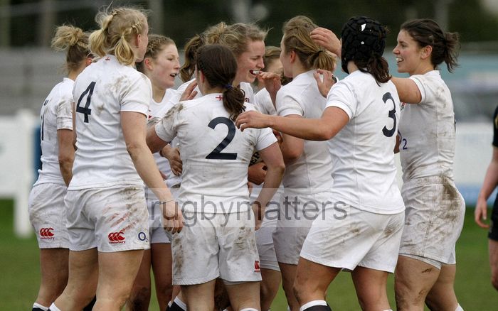 Team mates celebrate and congratulate Amber Reed on scoring a try. England Women v Scotland Women at Esher RFC on 2nd February 2013.