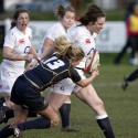 Becky Essex crashes through Annabel Segeant's tackle. England Women v Scotland Women at Esher RFC on 2nd February 2013.
