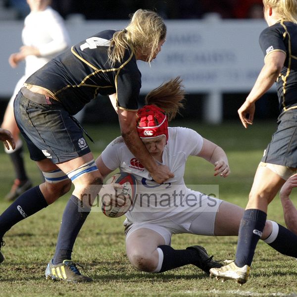Harriet Millar-Mills tackled by Lindsay Wheeler. England Women v Scotland Women at Esher RFC on 2nd February 2013.