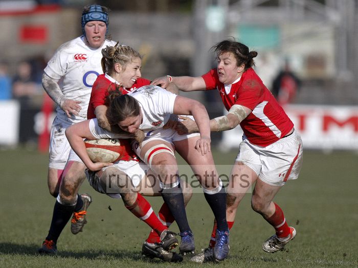 Kim Oliver tackled by Elinor Snowsill and Elen Evans. Wales Women v England Women at Talbot Athletic Ground, Manor Street, Port Talbot, West Glamorgan, Wales on 17th March 2013 KO 1430