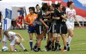 Natasha Hunt is pushed into touch after the buzzer marked the last play of the game, New Zealand celebrate winning the Cup Quarter Final. IRB RWC 7s at Luzhniki Stadium, Moscow, 30th June 2013