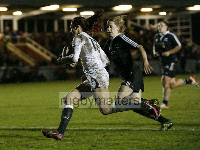 Joanne Watmore crosses the line to score a try, closely pursued by Kelly Brazier.England v New Zealand in Autumn International Series at Army Rugby Stadium, Aldershot, 27th November 2012.