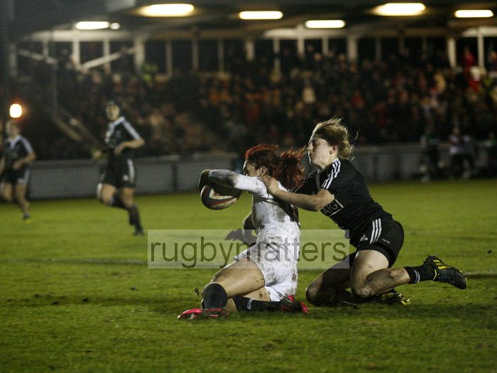 Joanne Watmore scores a try with Kelly Brazier attempting a tackle. England v New Zealand in Autumn International Series at Army Rugby Stadium, Aldershot, 27th November 2012.