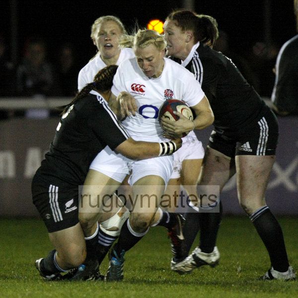 Tamara Taylor tackled by Fiao'o Fa'amausili and Casey Robertson. England v New Zealand in Autumn International Series at Army Rugby Stadium, Aldershot, 27th November 2012.