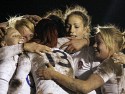Jo Watmore engulfed by her team mates after scoring a try and sealing series victory. England v New Zealand in Autumn International Series at Army Rugby Stadium, Aldershot, 27th November 2012.