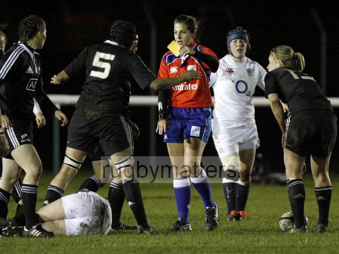 Referee Clare Daniels produces a yellow card to Katy McLean,  whilst she lies on the pitch bleeding. England v New Zealand in Autumn International Series at Army Rugby Stadium, Aldershot, 27th November 2012.