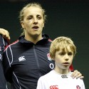 Katy McLean sporting a black eye gained during the previous Test at Aldershot, with Mascot during The National Anthem. England v New Zealand in Autumn International Series at Twickenham, England on 1st December 2012.