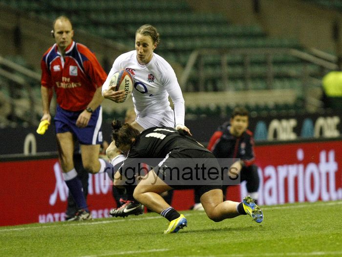 Kat Merchant tackled on the wing by Shakira Baker. England v New Zealand in Autumn International Series at Twickenham, England on 1st December 2012.