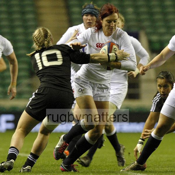 Jo Watmore tackled by Kendra Cocksedge. England v New Zealand in Autumn International Series at Twickenham, England on 1st December 2012.