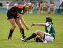 Inge Visser of Netherlands helps Joana Vieira of Portugal to her feet at the end of the match, after she injured herself crossing the line only to not have a try awarded. FIRA-AER Womens Grand Prix 7s at Stadium Municipal,  Brive, 2nd June 2013.