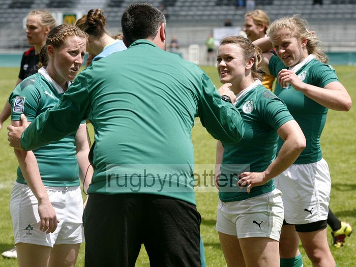 Ireland coach Jon Skurr talks to Claire Keohane, Lynne Cantwell and Claire Molloy.  FIRA-AER Womens Grand Prix 7s at Stadium Municipal,  Brive, 2nd June 2013.
