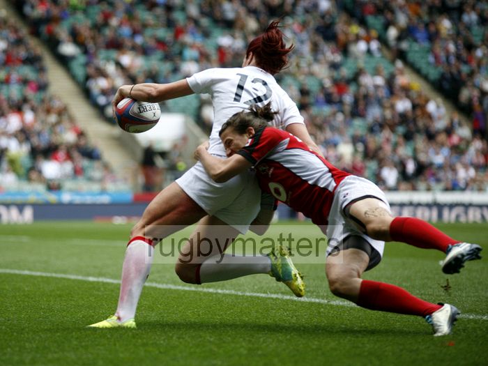 Jo Watmore scores a try despite the tackle of Ghislaine Landry. Womens International Invitational tournament at the Marriott London Sevens. At Cardinal Vaughan and Twickenham Stadium, Whitton Road, Twickenham. On 12th May 2013.