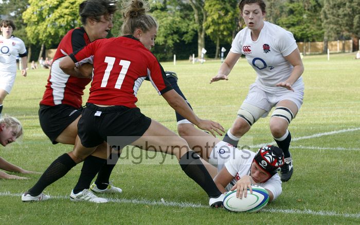 Bianca Blackburn grounds the ball to score a try. England v Canada in the U20's Nations Cup, Trent College, Derby Road, Long Eaton, Nottingham, 14th July 2013, kick off 1700.