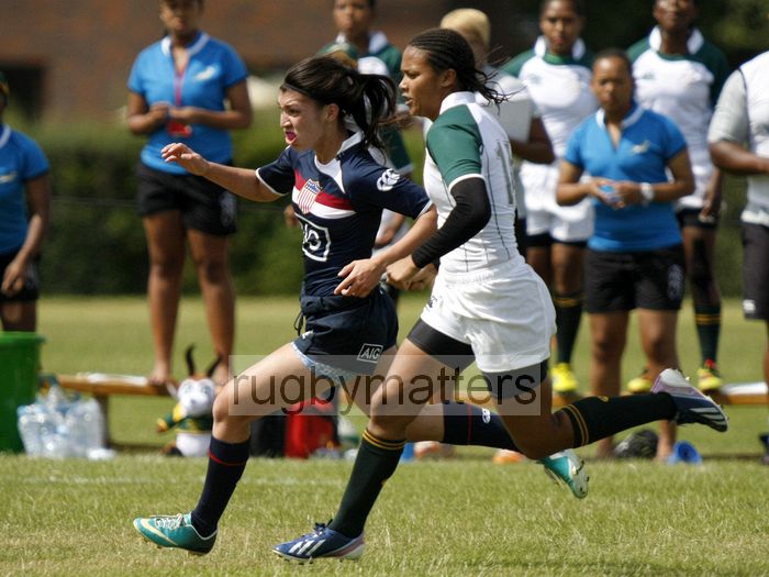 Stephanie Brown and Gabby Fisher chase a loose ball. South Africa v USA in the U20's Nations Cup, Trent College, Derby Road, Long Eaton, Nottingham, 14th July 2013, kick off 1400.