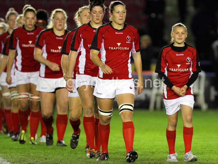 Kelly Russell and the mascot lead Canada out onto the pitch. England Women v Canada Women at Twickenham Stoop, Twickenham, England on 13th November 2013 ko 1900