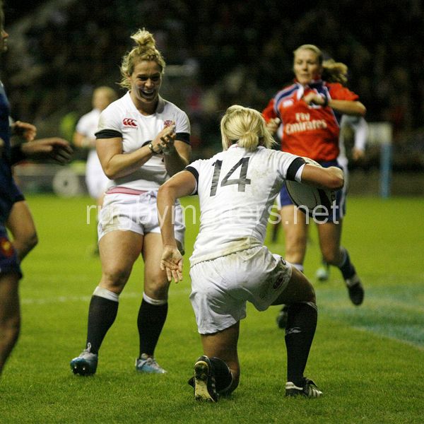 Rachael Burford runs to celebrate with Claire Allan on her scoring a try. England Women v France Women at Twickenham Stadium, Twickenham, England on 9th November 2013 ko 1705
