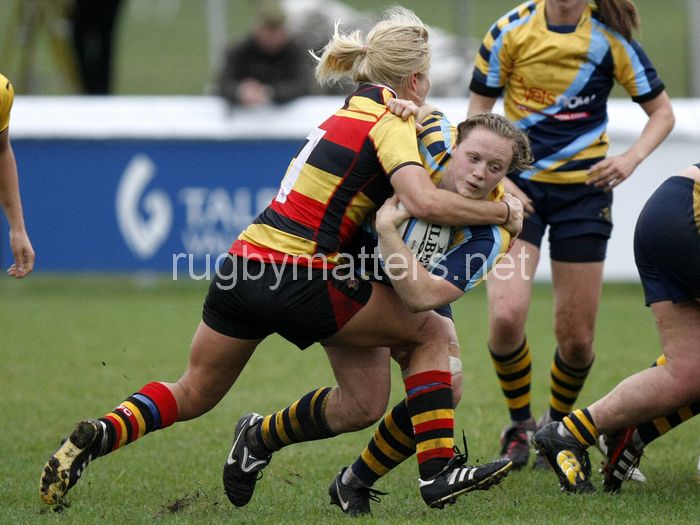 Jenny Mills tackled by Tess Forsberg. Richmond v Worcester at The Athletic Ground, Twickenham Road, Richmond on 15th September 2013, KO 1500. Richmond 26-12 Worcester.