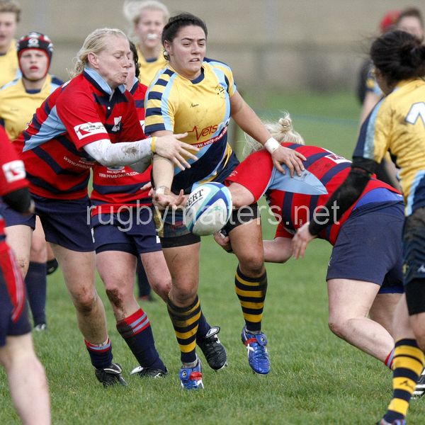 Lisa Campbell offloads the ball as she is being tackled. Worcester v DMP Sharks at Westons Land Pitches, Sixways, Pershore Lane, Worcester on 27th October 2013 ko 1400