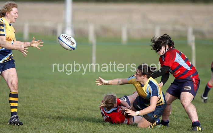 Lisa Campbell offloads the ball as she is being tackled. Worcester v DMP Sharks at Westons Land Pitches, Sixways, Pershore Lane, Worcester on 27th October 2013 ko 1400